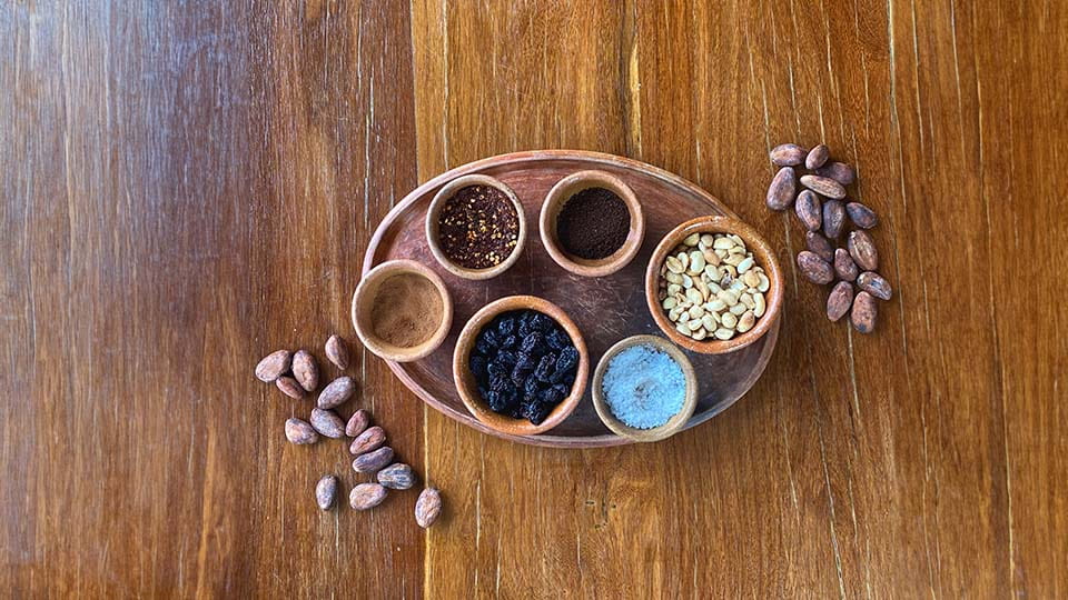 different spices for chocolate praline toppings in small bowls