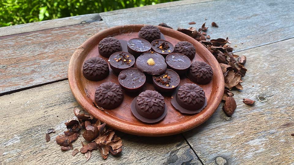 chocolate pralines on a clay plate